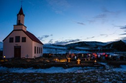 Church and graveyard with Christmas lights in Iceland