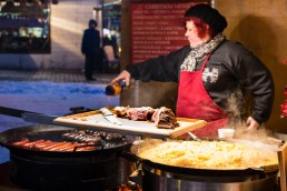 Preparing food at the Christmas market of Tallinn Old town, Estonia