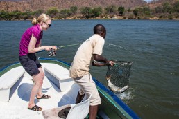 Niina catching her tigerfish in Lower Zambezi National Park, Zambia