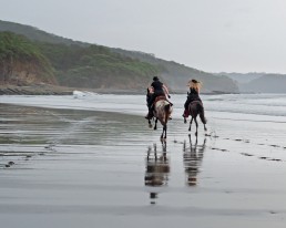 Piritta and Niina riding in full speed at Rancho Chilamate, Nicaragua