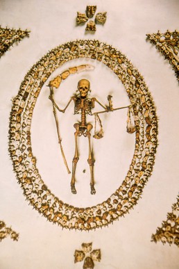 Skeleton in the ceiling of the Capuchin Crypt in Rome, Italy.