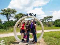 Us with a Ugandan family at the Equator, Uganda