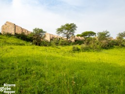 Idi Amin's Pakuba Safari Lodge ruins seen from the shore