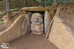 Aanother one of the few colorful statues in San Agustin Archeological Park, Colombia.