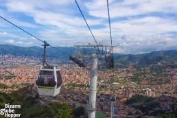 Ride Medellin's cable car up to the hills to Aurora. Glide upon the colorful barrios of Medellin and take in views to the city center.