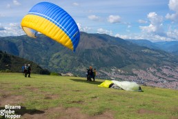 Running to take off to paraglide in Medellin, Colombia.