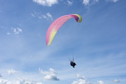 Paragliding through the blue skies in Medellin. One of the best travel experiences we had in Colombia!