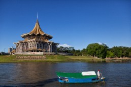 Kuching Waterfront lines the south bank of Sarawak river, offering scenic views towards Fort Margherita and the Astana