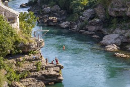 Bridge jumping candidite performing a rehearsal jump by the Old Bridge of Mostar