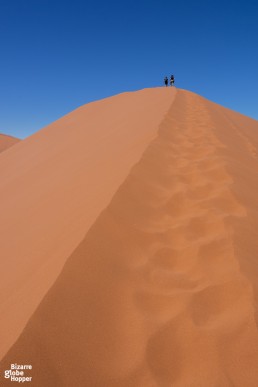 Climbing dunes in Namib desert, Namibia