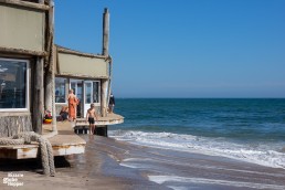 Kids swimming in front of Swakopmund's Tiger Reef Restaurant, Namibia